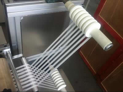 Ultrasonic ribbon slitting machine